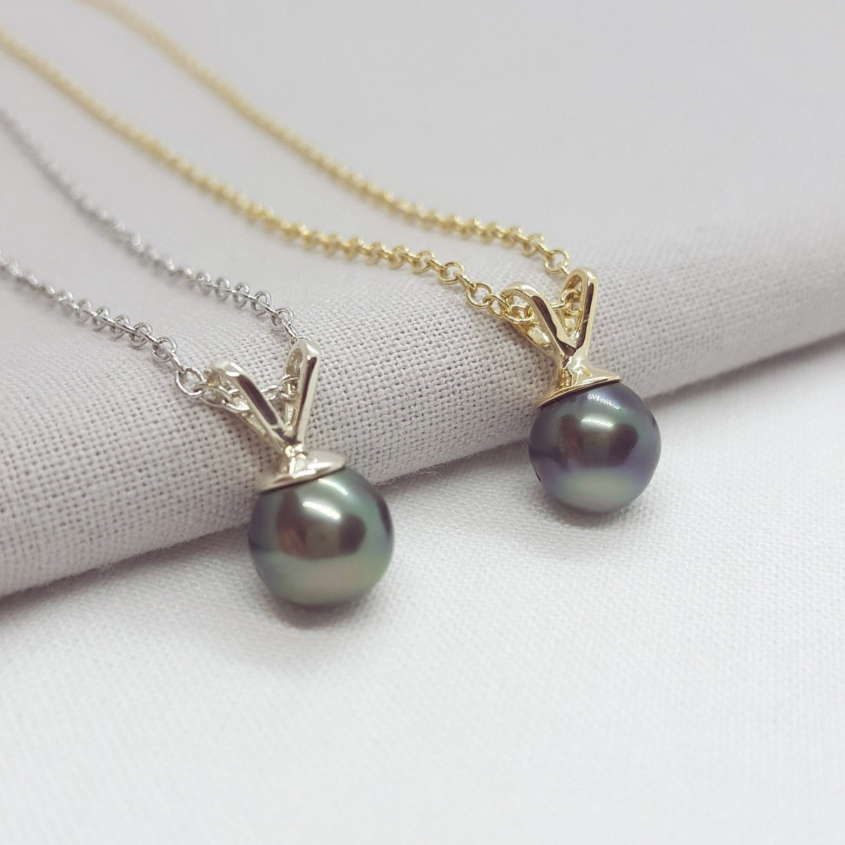 black tahitian pearl yellow and white gold necklaces.