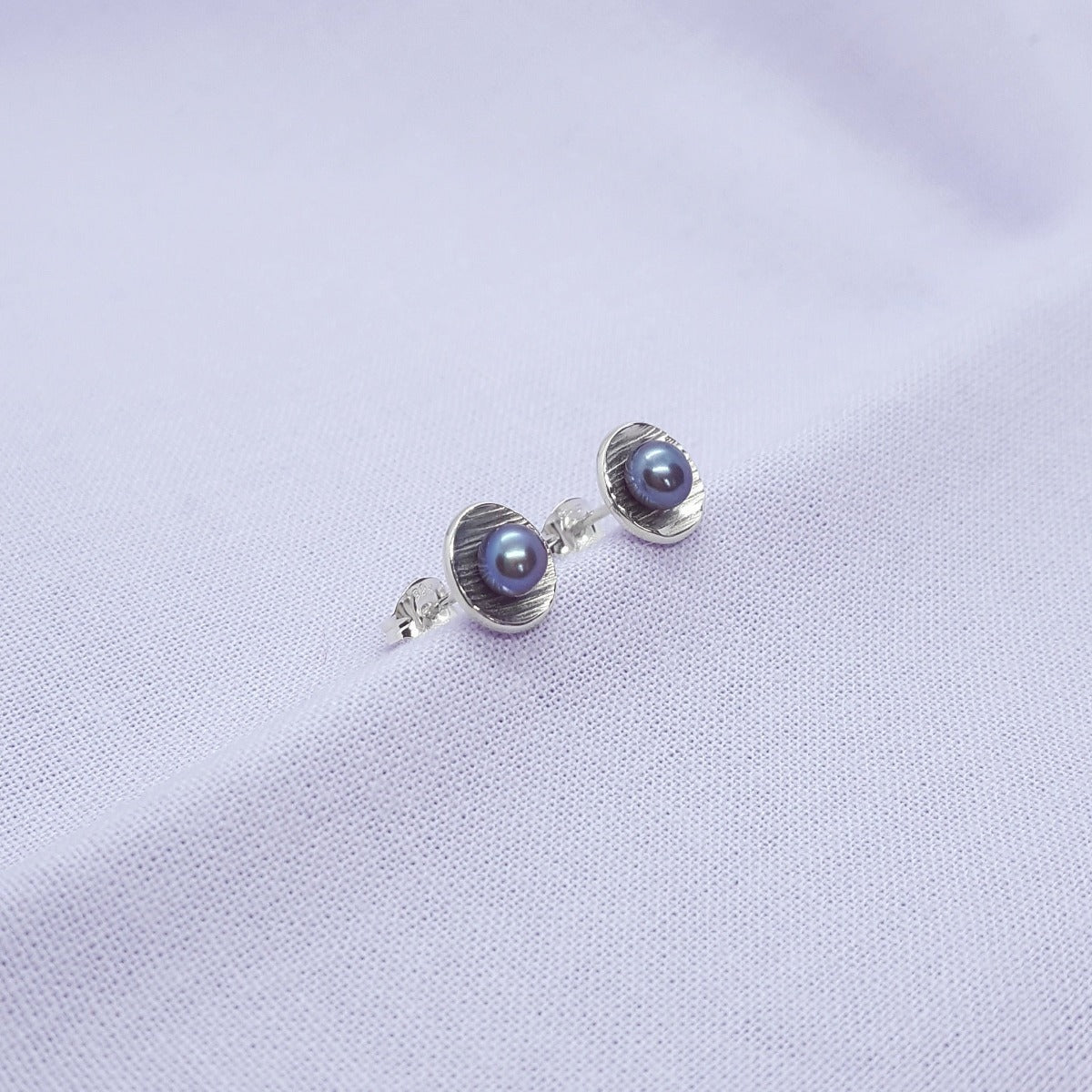 peacock freshwater pearl and textured silver handmade earrings