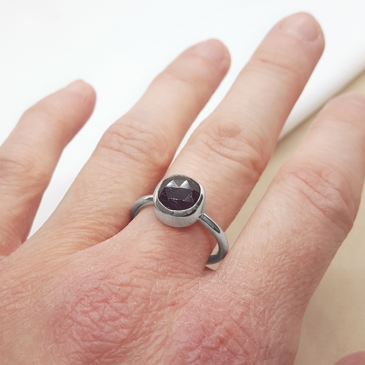 rose cut black tourmaline set in a silver handmade ring.