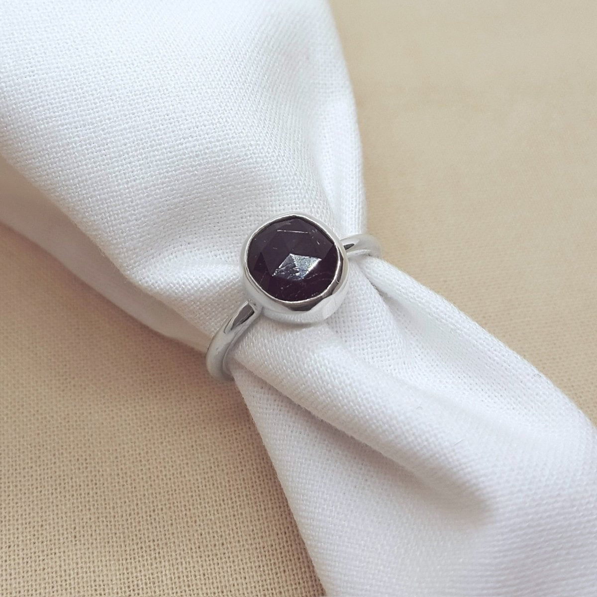 rose cut black tourmaline set in a silver handmade ring.