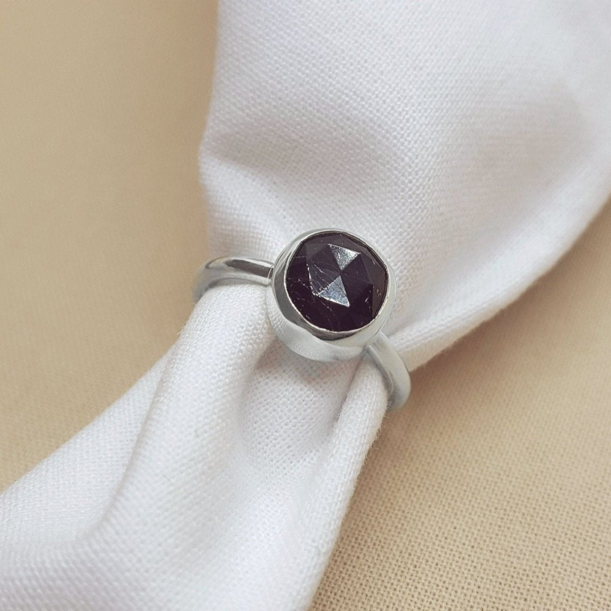 rose cut black tourmaline set in a silver handmade ring.