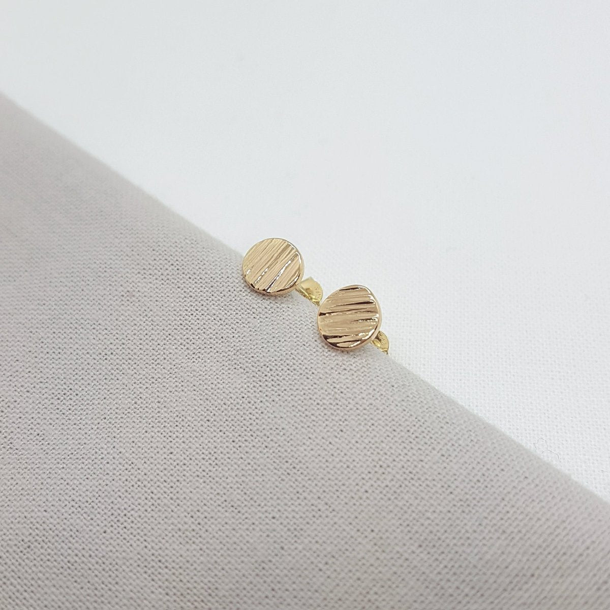 9ct yellow gold textured medium stud earrings. Handmade jewellery in Kent.