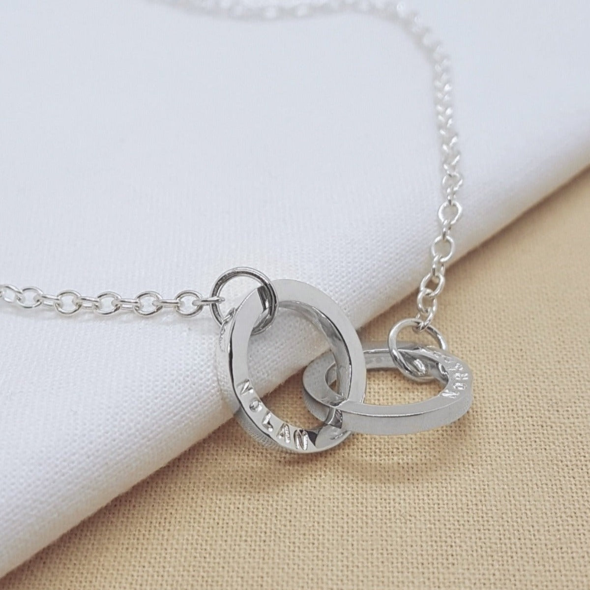 jewellery handmade in Kent silver interlocking circles personalised with hand stamped names