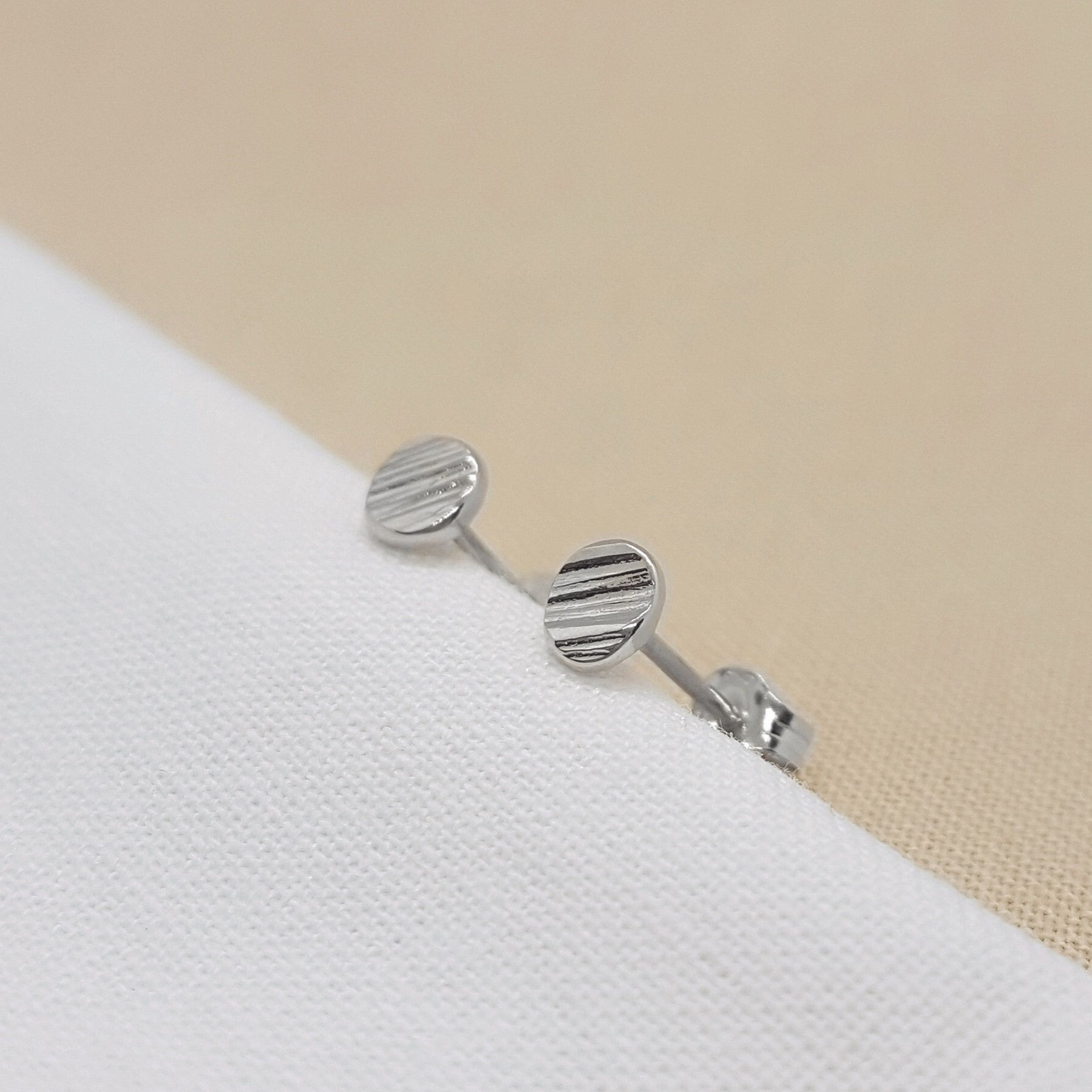 Mini textured stud earrings handmade from recycled silver