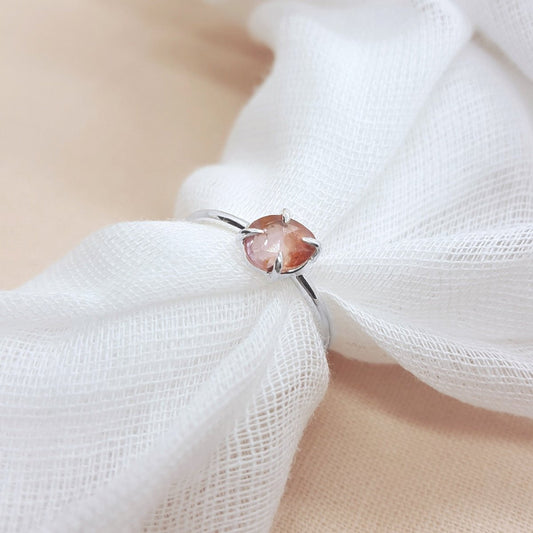 rose cut peach tourmaline set in a handmade silver ring