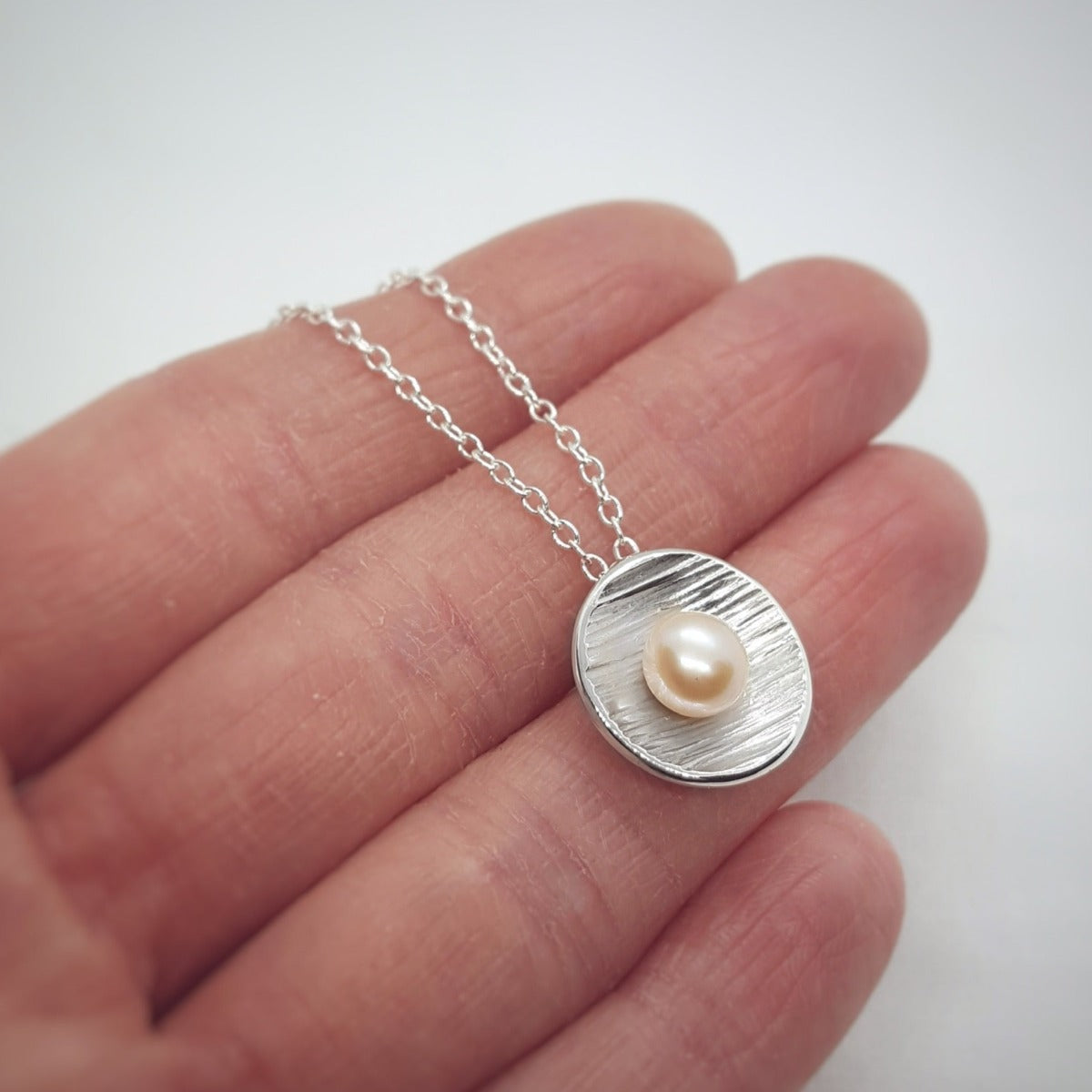 peach pearl silver handmade textured pendant