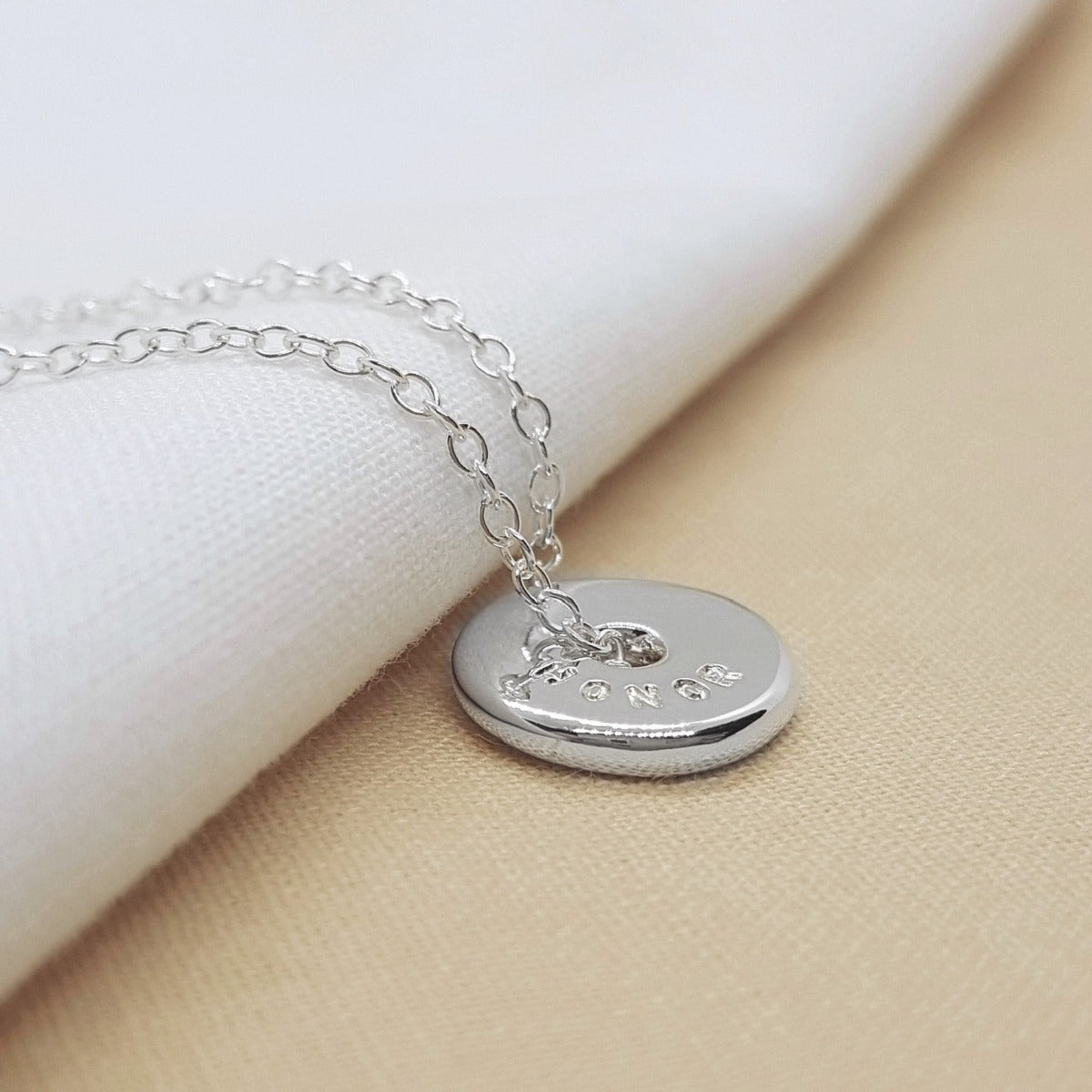 Personalised silver spinner necklace, handmade in Kent