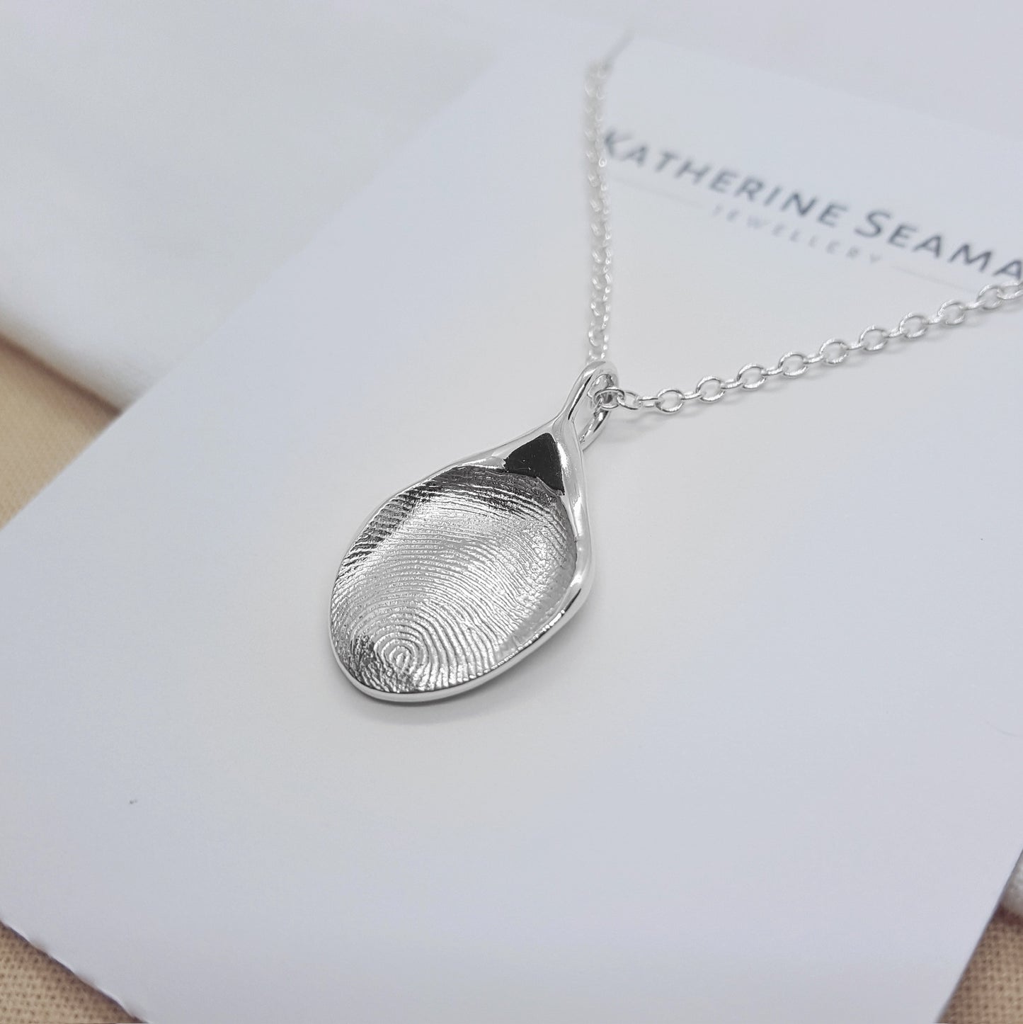 solid silver handmade from a direct imprint of a fingerprint