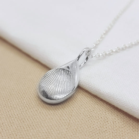 solid silver handmade from a direct imprint of a fingerprint