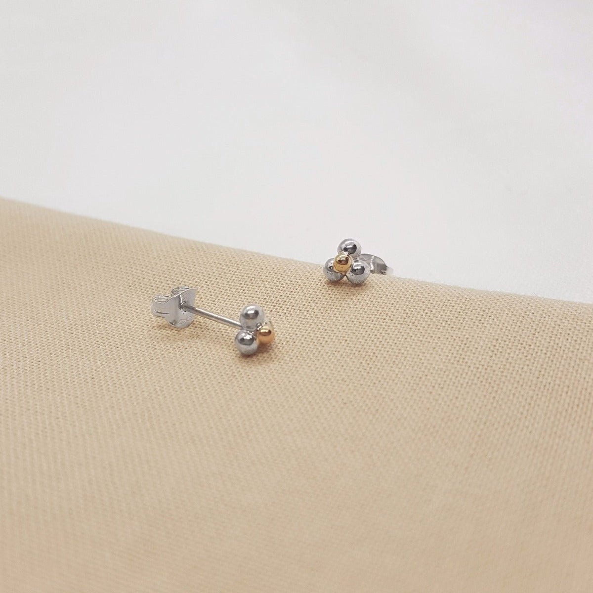three balls of silver and one 9ct yellow gold accent ball on each handmade earring