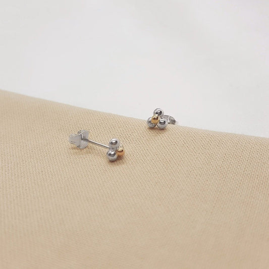 three balls of silver and one 9ct yellow gold accent ball on each handmade earring