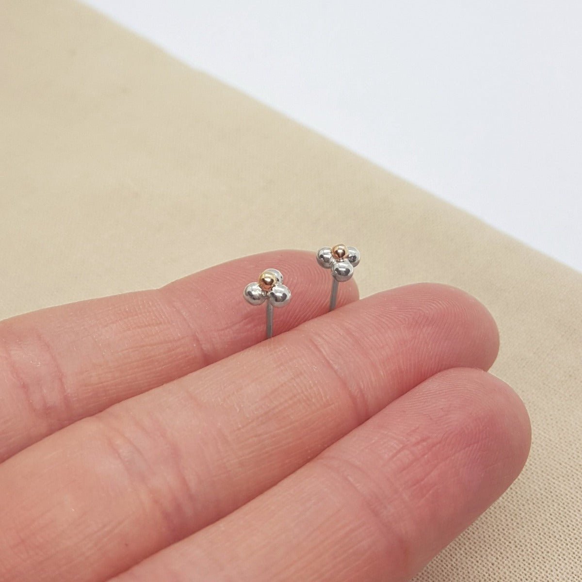 three balls of silver and one 9ct yellow gold accent ball on each handmade earring