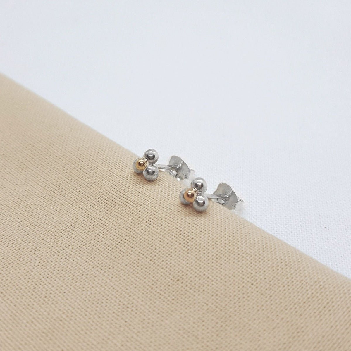three balls of silver and one 9ct yellow gold accent ball on each handmade earring