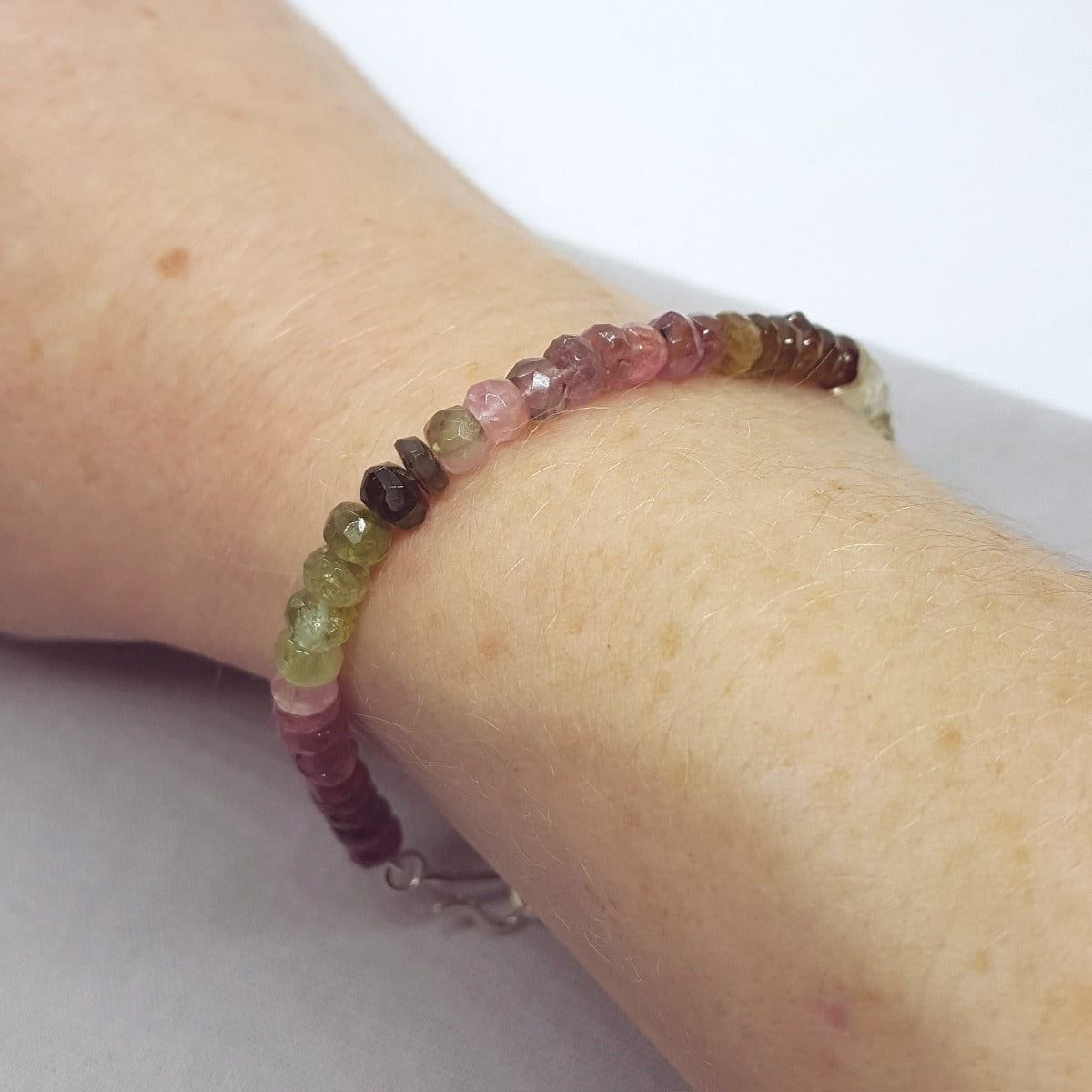 Multi coloured rondelle shaped tourmaline bracelet with a handmade silver clasp, handmade in Kent