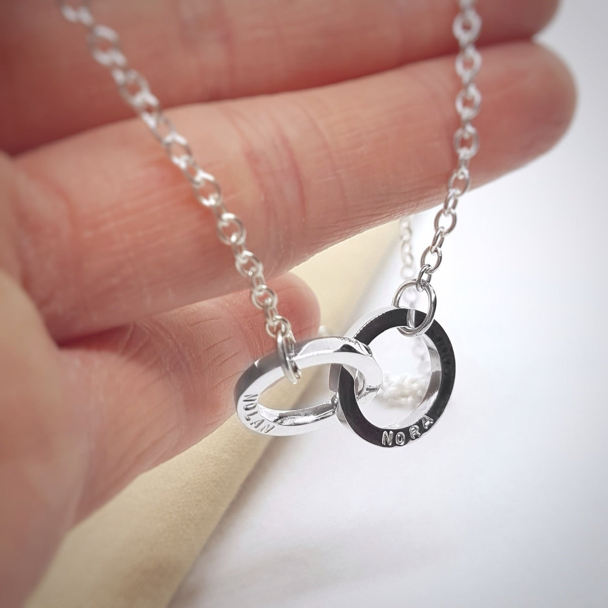 jewellery handmade in Kent silver interlocking circles personalised with hand stamped names