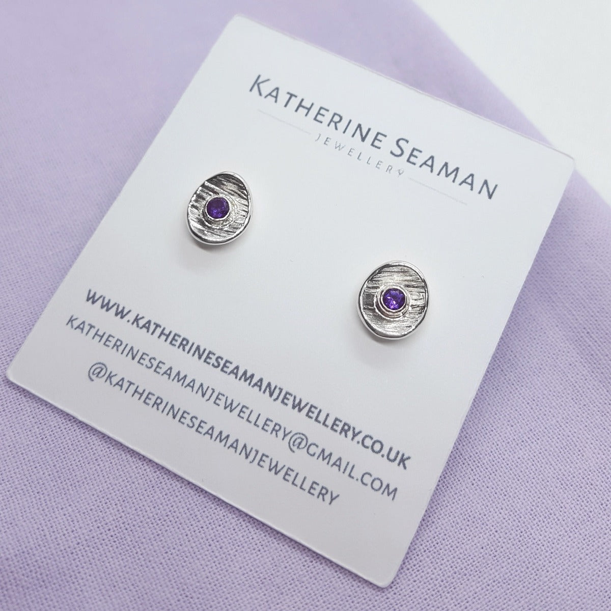 faceted amethyst gemstones set in textured sterling silver cup earrings, handmade jewellery in Kent