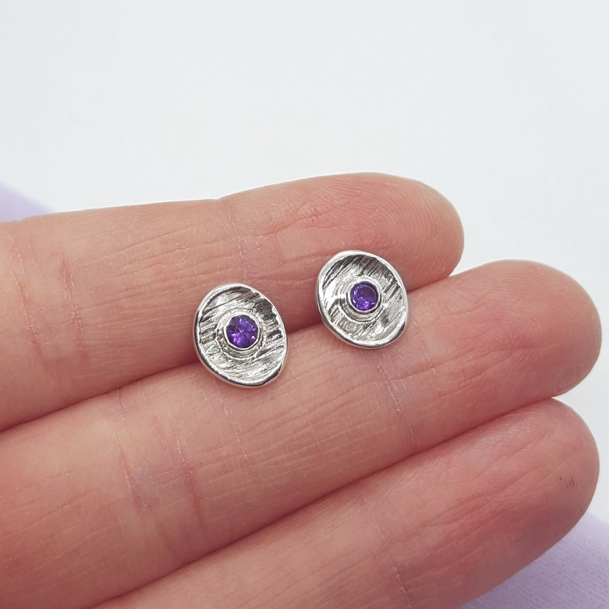 faceted amethyst gemstones set in textured sterling silver cup earrings, handmade jewellery in Kent