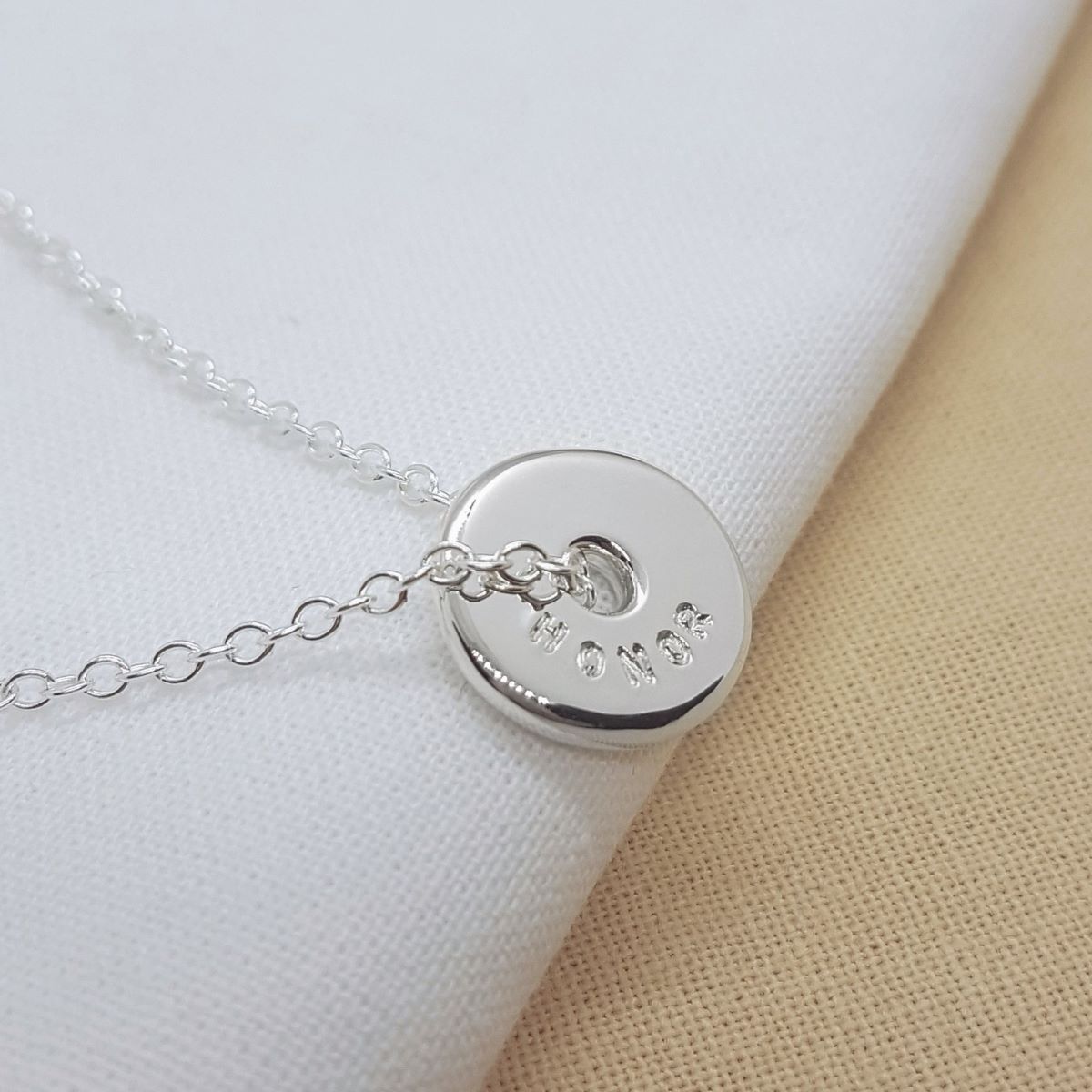 Spinner silver necklace with hand stamped names, handmade in Kent