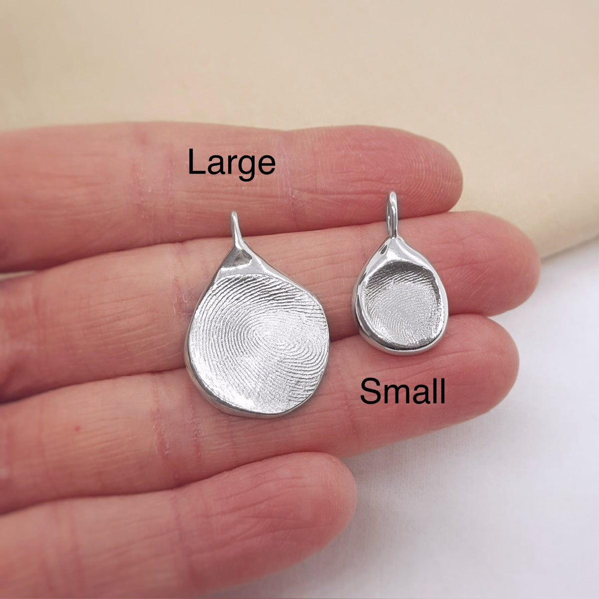 large and small silver fingerprint pendant