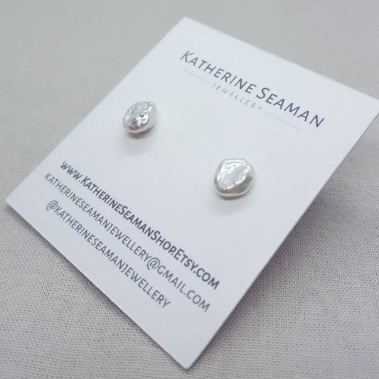 white keshi pearl earrings set on silver posts and scrolls. Handmade jewellery in Kent