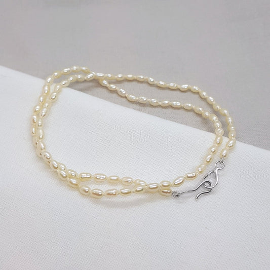 ivory rice pearl hand knotted on silk thread and finished with a handmade silver clasp